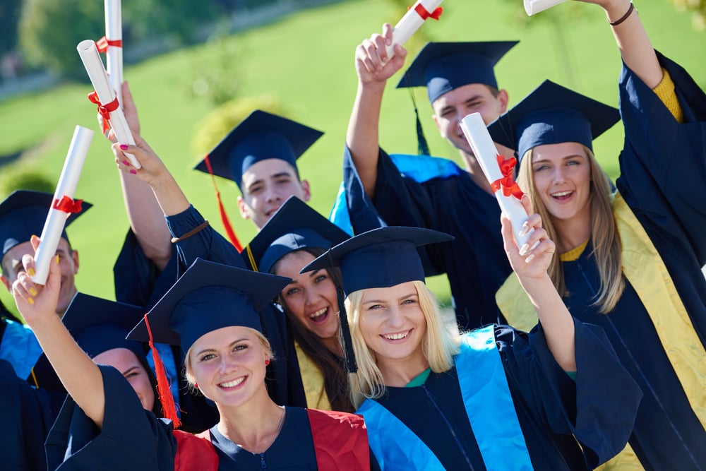 young graduates students group  standing in front of university building on graduation day-2